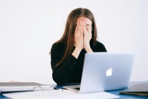 Stressed Lady working on a laptop